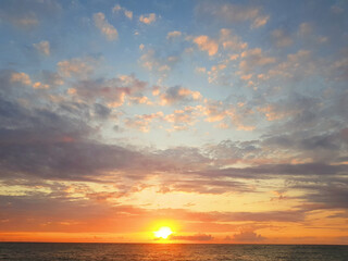 Wall Mural - sunset on sea beach. beautiful nature background. sky, clouds and sun light