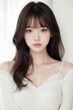 © Eggy - Female Asian Model with Long Hair - Young Beautiful Woman with Wavy Hair - Studio Portrait of Asian Beauty for Fashion, Cosmetic, Skincare - Posing on White Background - Smooth Styled Hair with Bangs