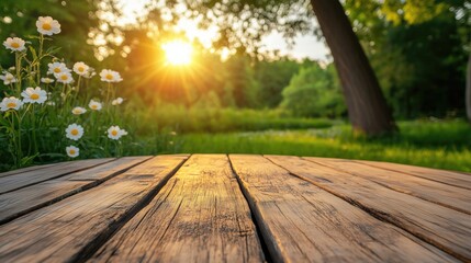 Wall Mural - a rustic wooden table in the foreground with blooming daisies and a vibrant sunset in the background