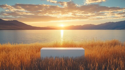Wall Mural - Tranquil scene of a white bench by a lake at sunset, surrounded by golden grass and mountains in the background.