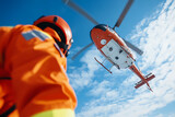 Emergency Responder and Helicopter: A low-angle shot of a person in emergency gear and a helicopter against a blue sky.