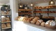 © chartchai - Cozy Bakery Setting Showcasing Variety of Artisanal Bread Loaves and Pastries