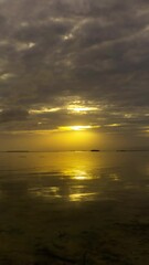 Wall Mural - sea surface during a beautiful colourful sunset, timelapse. vertical video 4k
