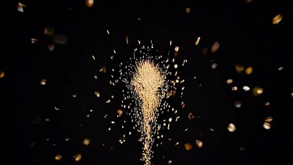 Poster - Golden particles exploding from the center against a deep black background, creating a dynamic display of energy and movement, radiating vibrant light and shimmering brilliance