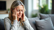 © alpermer - A woman suffering from migraine pain - Generative AI