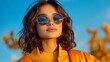 © studio clever - Fashionable Woman in Yellow Jacket with Sunglasses Against Bright Sky. Generative AI