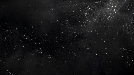 Dark background with white speckles resembling stars or dust, Night sky texture background