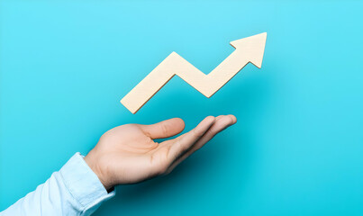 Poster - Hand Holding Growth Arrow on Blue Background for Business Concept