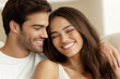 © Vasili - Couple smiling and enjoying a moment together, showcasing love, happiness, and affection in a cozy home setting. The image radiates warmth and connection.