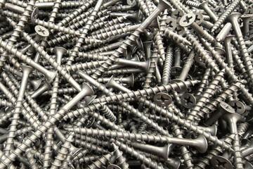 Poster - Scattered metal screws reflect construction and organization needs