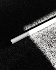 Aufkleber - Strength and Simplicity Represented by a White Cane Resting on a Surface and Casting a Bold Shadow