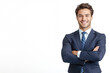 © lastpresent - A smiling male businessman in a suit with his arms crossed and a confident look on a white background with copy space.
