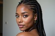 © Nina - Portrait of a Beautiful Young Black Woman with Braided Hair in Soft Lighting, Showcasing Natural Beauty and Confidence