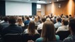 © piyawat - Conference Room with Diverse Audience and Speaker Presenting in Front of Projector Screen