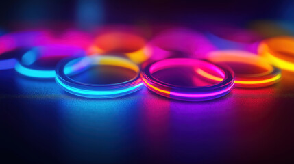 Poster - Glowing neon rings in vibrant colors layered on a dark reflective surface with subtle granular paper