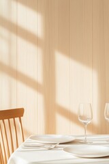 Poster - close-up of elegant dining table set with minimalist cutlery and white plates surrounded by soft natural light illuminating