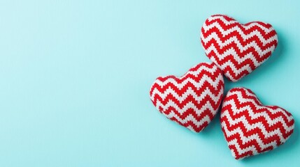 Aufkleber - Two knit hearts placed on a blue background showcasing handmade textile art and love symbolism