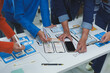 © crizzystudio - Ux designers collaborating on wireframes while analyzing a smartphone, focusing on creating an innovative mobile application that enhances user experience and interface design