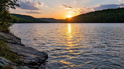 Wall Mural - Sunset over a serene lake nature photography tranquil environment scenic view reflective water ripples