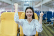 © Witoon - A cool businesswoman sits by the airplane window. She enjoys a luxurious travel experience that symbolizes success, adventure, and the excitement of traveling to new destinations.