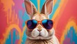 © Rama - A stylish bunny rocking sunglasses, set against a vibrant and eye-catching multicolored background. perfect for easter concept