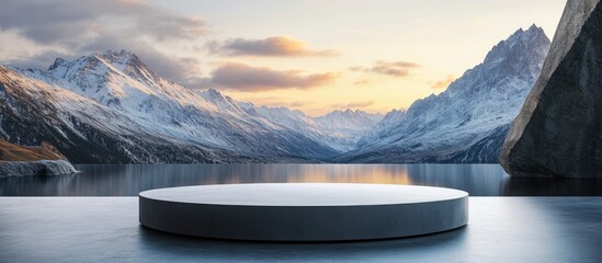 Aufkleber - Mountain view podium stage featuring a smooth gray slab pedestal set against a serene sunset with snow-capped peaks and calm waters in the background