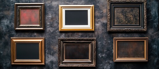 Poster - Rustic vintage frames in gold and brown tones arranged in a grid on a textured dark gray wall creating an artistic exhibition display