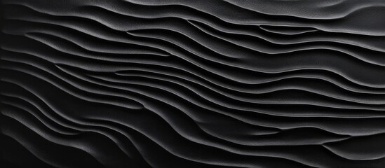 Poster - Textured waves of rich black clay create a visually striking background, featuring smooth contours and distinct patterns across the surface.