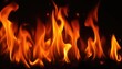 © Pixsite - Close-up of vibrant orange flames dancing in the dark.
