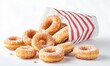 © simba kim - mini apple cider donuts in a small white and red striped paper bag, Generative AI