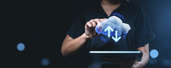 Fototapete - Cloud storage concept. Person using a tablet with a virtual cloud and data transfer arrows, symbolizing online storage and remote network access.