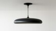 © jirapong - Sleek Modern Black Ceiling Lamp with Minimalist Design and Elegant Illumination in a Bright Room with White Background