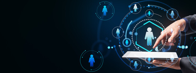 Aufkleber - Hand selecting icon on tablet with network of people in background.
