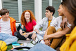 © Xavier Lorenzo - Young group of multiracial teenage students hanging out at high school campus. Education lifestyle concept