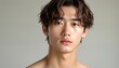 © KarpenArt Studio - A close-up shot of two Asian men with wet hair against a grey background.