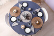© Pixel-Shot - Stylish table setting with cups for tea party in room. Top view