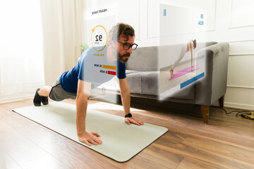 Man exercising at home using augmented reality glasses displaying workout data and a virtual personal trainer guiding his fitness routine