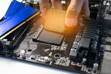 Fototapete - The technician is installing the CPU onto the motherboard.