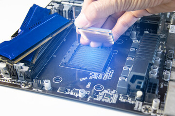 Fototapete - The technician is installing the CPU onto the motherboard.