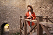 © Andrii Lysenko - tourist woman enjoying sightseeing visiting ancient fortress, exploring historical architecture, admiring medieval walls, experiencing travel adventure, discovering cultural heritage