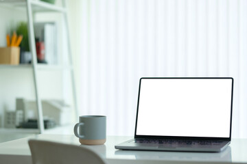 Fototapete - Minimalist home office with laptop and coffee cup.