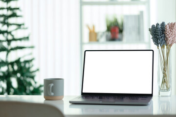 Fototapete - Modern workspace featuring a sleek laptop with a blank white screen