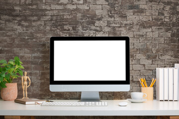 Aufkleber - Modern workspace featuring a desktop computer with a blank screen, rustic brick wall background, and neatly arranged office decor