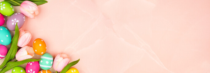 Aufkleber - Colorful Easter eggs and pink spring tulip flowers. Top view bottom border against a pink stone banner background. Copy space.