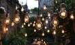 © jambulart - Illuminated light bulbs create a warm, inviting garden.
