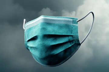 Poster - A face mask icon in the center of a hazy, gray background, symbolizing air pollution
