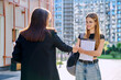 © Valerii Honcharuk - Teenage girl student talking to female teacher, outdoor