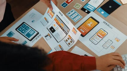 Poster - top view panorama video of startup company employee planning on user interface prototype for mobile 