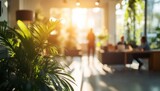 Sunlit Office Oasis: Plants and Blurred Professionals