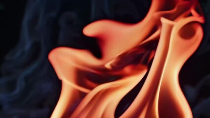 Poster - Close-up of orange and yellow flames on black background, vibrant energy concept